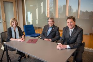 Nancy Mueller, President Paul Pribbenow and Paul Mueller